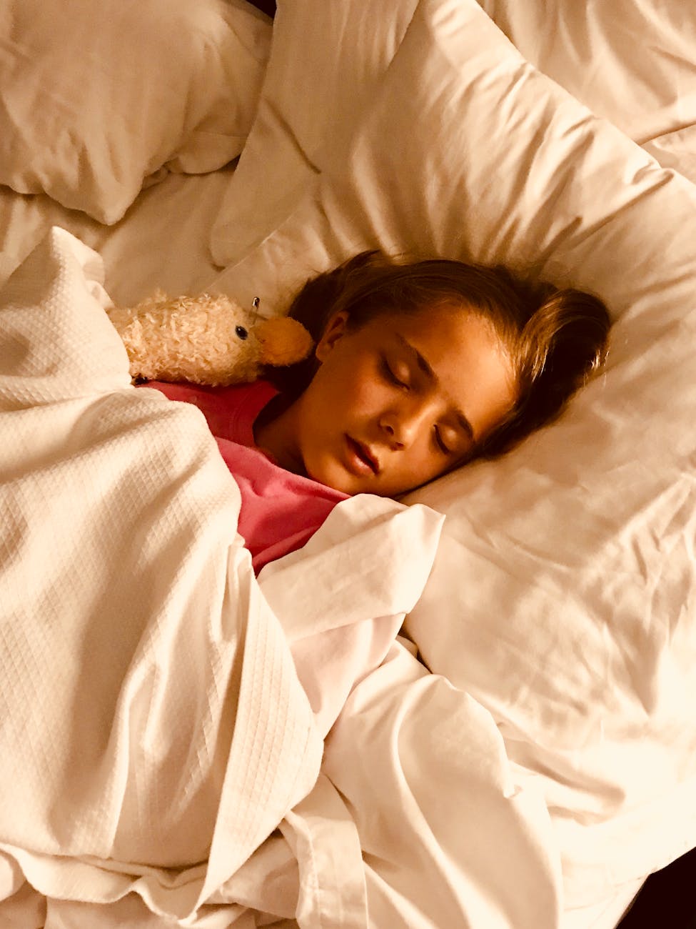 girl sleeping on bed